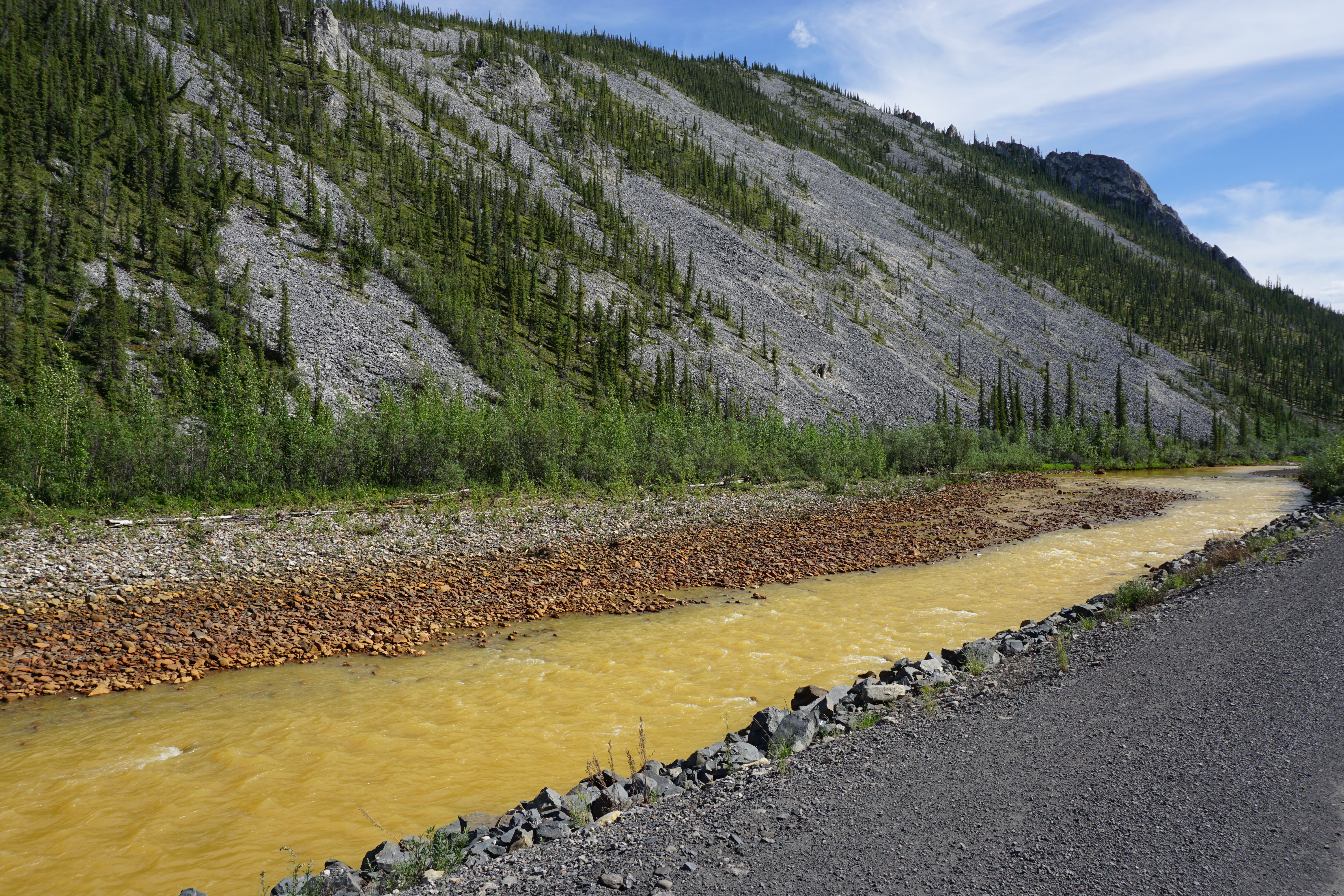 Orange rusty river along the mountain side