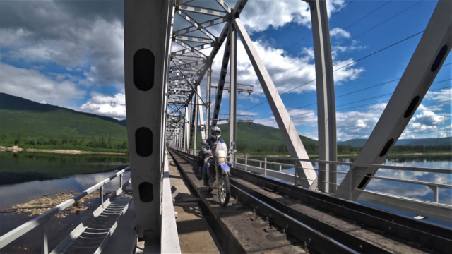 Crossing Olyokma river via the railway bridge